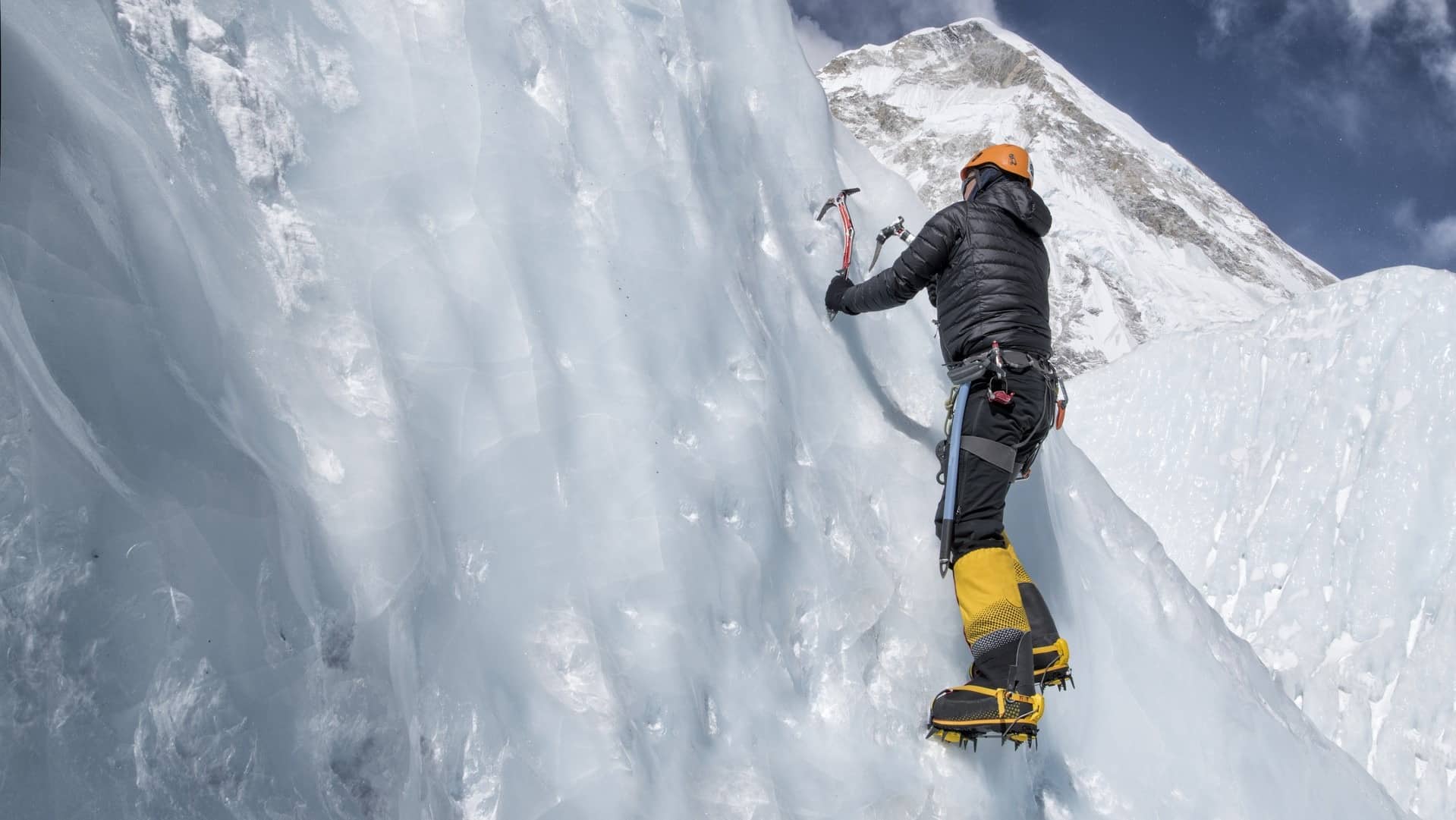 Man Ice climbing