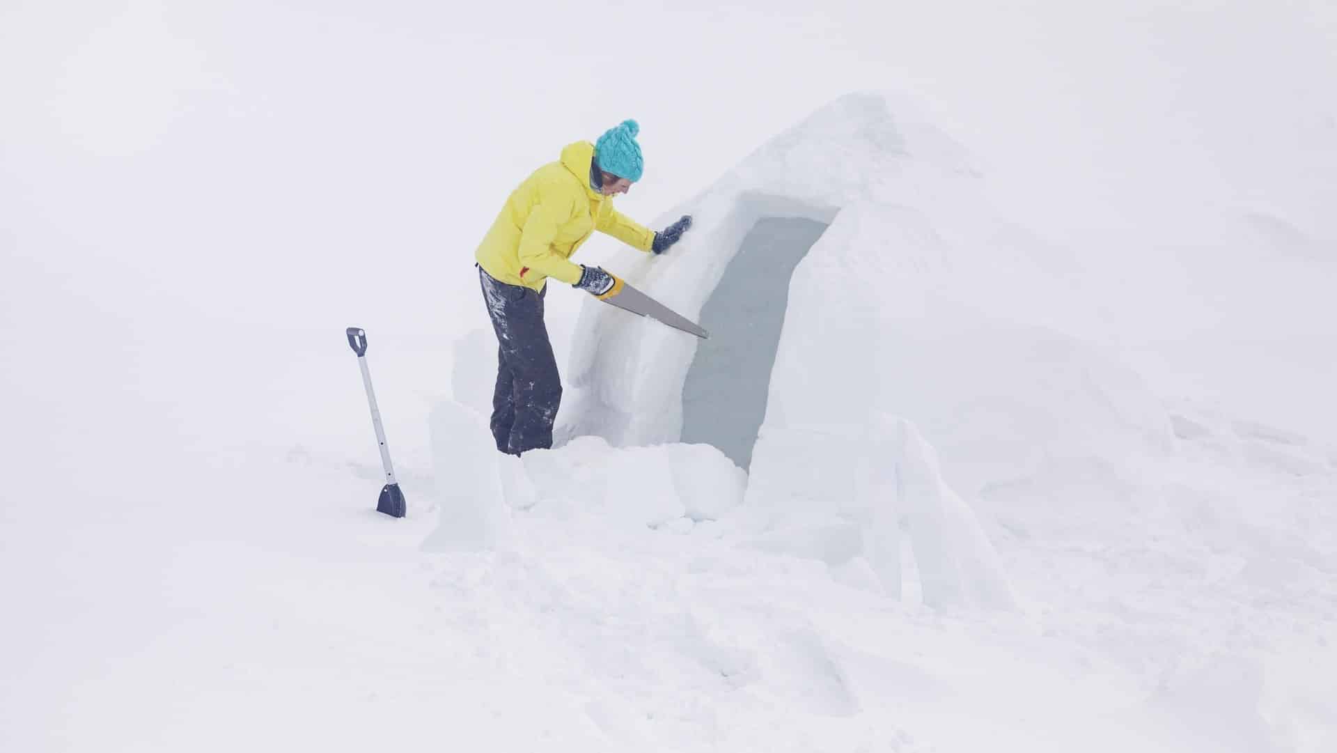 Woman building an igloo